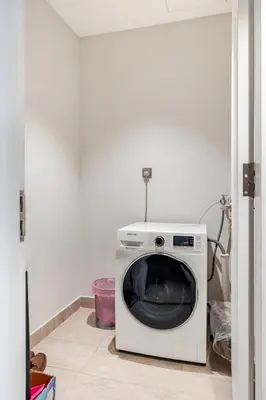 a white microwave sitting on the floor in a room at Designer Luxury Condo Near Bukit Bintang in Kuala Lumpur