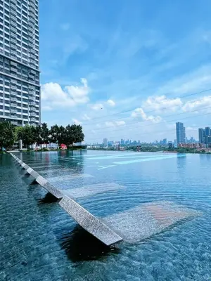 a large body of water with a city in the background at ISYAK Homestay Cheras M Vertika KL in Kuala Lumpur