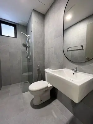a bathroom with a sink and a toilet and a mirror at ISYAK Homestay Cheras M Vertika KL in Kuala Lumpur