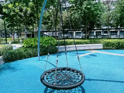 a tire swing hanging from a pole in a park at ISYAK Homestay Cheras M Vertika KL in Kuala Lumpur