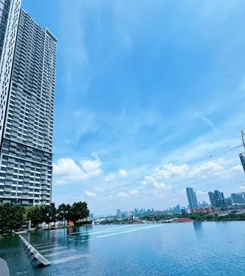 a view of a river in a city with buildings at ISYAK Homestay Cheras M Vertika KL in Kuala Lumpur