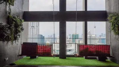a room with a large window with a view of a city at Riveria City KL Sentral by Nest Suite in Kuala Lumpur