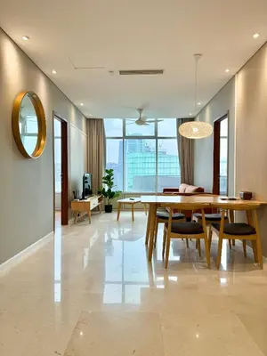 a dining room with a table and a mirror at Sky Suites Klcc By Stayner in Kuala Lumpur
