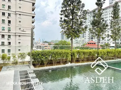 a swimming pool in the middle of a city with buildings at KaMi Mont Kiara Residences & Hotel by Ireka in Kuala Lumpur