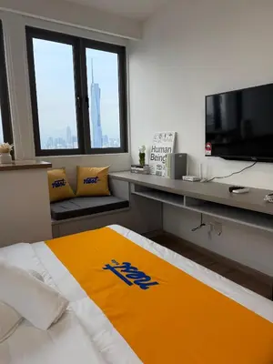 a hotel room with a bed and a television at Nest Haven KL in Kuala Lumpur