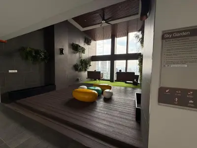 a lobby with a room with a large window at Nest Haven KL in Kuala Lumpur