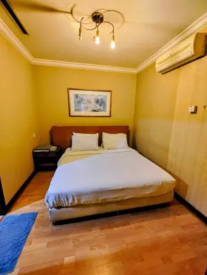 a bedroom with a large bed in a room at Twobedroom Hotel Apartment At Times Square Kuala Lumpur in Kuala Lumpur