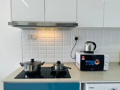 a kitchen with two pots and a toaster oven at In