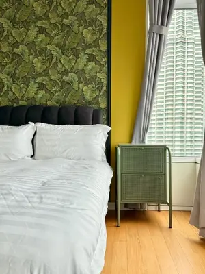 a bedroom with a bed and a wall mural at Sky Suites Klcc By Stayner in Kuala Lumpur