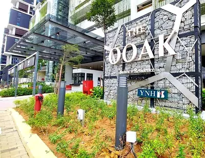 a building with a sign on the side of it at KL Mont Kiara The Ooak Entire Unit in Kuala Lumpur