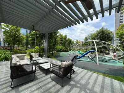 a patio with chairs and a playground with a slide at Agile Bukit Bintang TRX KL by Lilbean Space - 2B1R in Kuala Lumpur