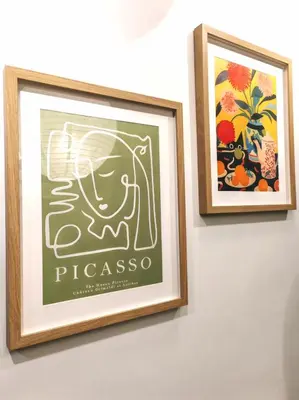 two framed pictures hanging on a wall at Sunway Velocity Two Direct Link to Sunway Velocity Mall MRT TRX in Kuala Lumpur
