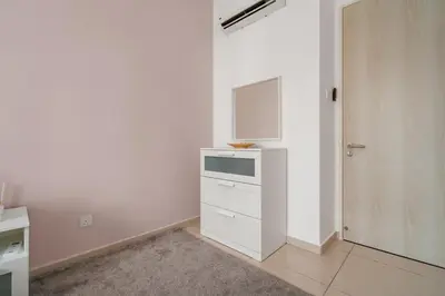 a white kitchen with a dresser and a tv at Legasi 3 Premium Bedroom With KLCC View 10min Walk to KLCC Comes With Board Games and PS4 Fit Up To 10PAX in Kuala Lumpur