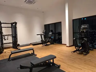 a gym with several exercise equipment in a room at MidValley Bangsar Stylish Suite by DingDing in Kuala Lumpur