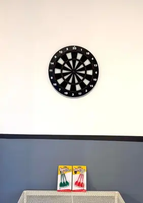 a dart board on a wall with a dartboard at Arcoris Soho 163 Mall Luxury 2Bedroom With City View in Kuala Lumpur