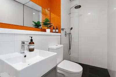 a bathroom with a sink and a toilet and a shower at Arcoris Soho 163 Mall Luxury 2Bedroom With City View in Kuala Lumpur
