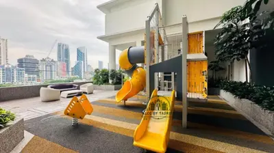 a playground with a slide on a building at The Luxury Quill Residence KLCC By Tasrifa in Kuala Lumpur