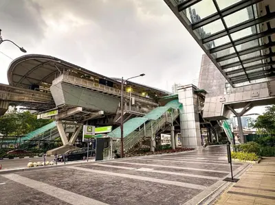 a building with an escalator with a train on it at The Luxury Quill Residence KLCC By Tasrifa in Kuala Lumpur