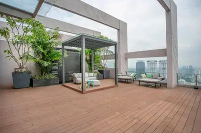 an outdoor deck with furniture on a building at Riveria City Kuala Lumpur in Kuala Lumpur