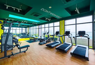 a gym with several treadmills and cardio machines at Riveria City Kuala Lumpur in Kuala Lumpur