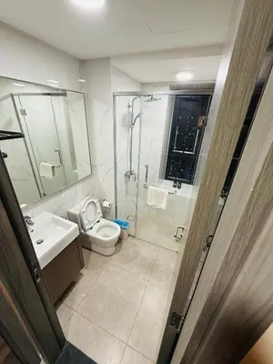a bathroom with a shower and a toilet and a sink at Agile Delima Luxury suite Bukit Bintang in Kuala Lumpur