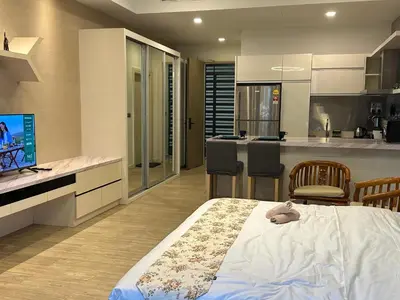 a bedroom with a bed and a kitchen at MCity Studio With Balcony, Near KLCC, Gleneagles Hosp, Ampang Puteri Hosp in Kuala Lumpur