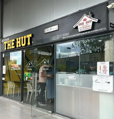 a man standing in the door of a restaurant at MCity Studio With Balcony, Near KLCC, Gleneagles Hosp, Ampang Puteri Hosp in Kuala Lumpur