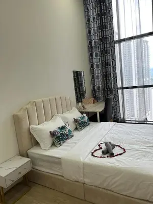 a bedroom with a bed with a teddy bear on it at MCity Jalan Ampang 5mins KLCC, Gleneagles Hospital in Kuala Lumpur