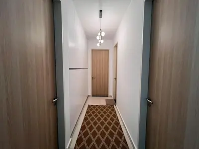 a hallway with a door and a hallwayngth at Legasi Kg Bharu with KLCC view near LRT Station in Kuala Lumpur