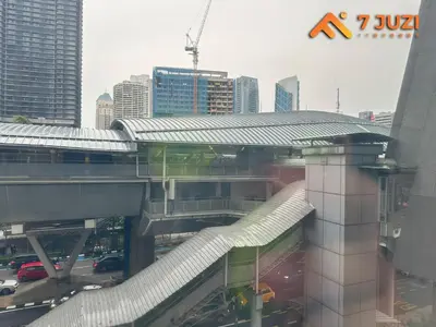 a train station in a city with buildings at Luxury and Cozy Suite KL and 118 TOWER View Netflix 1080HD in Kuala Lumpur