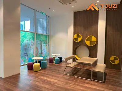 a waiting area with tables and chairs in a building at 2BED Luxury Cozy Suite 118TOWER view with NetflixHD1080 in Kuala Lumpur