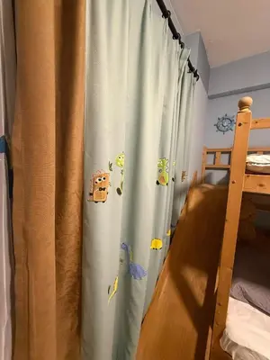 a bedroom with a curtain with animals on it at Bintang Home in Kuala Lumpur