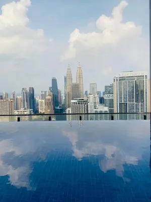 a swimming pool with a view of the city at Dreamy Destiny Suites At KLCC Swimming Pool View in Kuala Lumpur