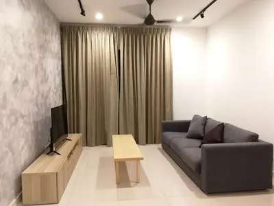 a living room with a couch and a tv at Velocity mall & Mytown ikea with Stunning KLCC view in Kuala Lumpur