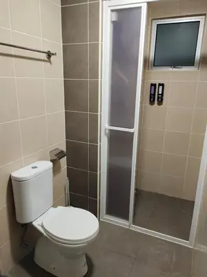 a bathroom with a toilet and a shower at Modern and Comforts RC Residence Fully Aircond in Kuala Lumpur
