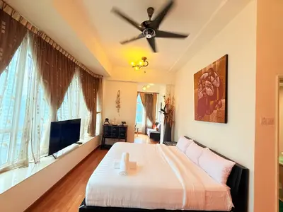 a bedroom with a bed and a ceiling fan at Park view Apartment near klcc in Kuala Lumpur