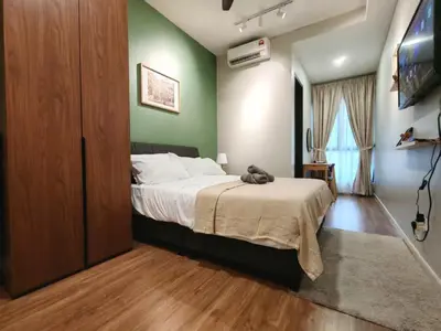 a bedroom with a bed with a teddy bear on it at Studio Sunway Velocity 2 Link Bridge to Mall in Kuala Lumpur