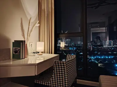 a desk in a room with a view of a city at Expressionz KLCC By Laze Home in Kuala Lumpur