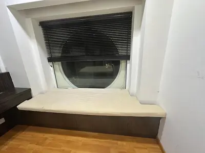 a bed in a room with a window at Parkview Family Suite klcc with views in Kuala Lumpur