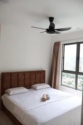 a bedroom with a bed with two pillows and a window at Cozy kenwingston platz kl 2-5pax 2BR&2BR Klcc view free paikin wifi1907 in Kuala Lumpur