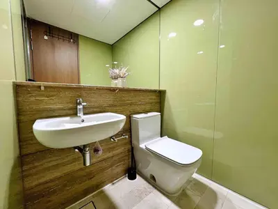 a bathroom with a sink and a toilet at Sky Suites Luxury unit with KLCC view in Kuala Lumpur