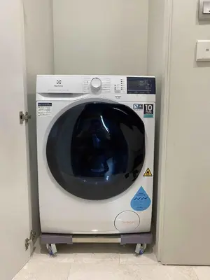 a washing machine is sitting in a room at Sky Suites Luxury unit with KLCC view in Kuala Lumpur