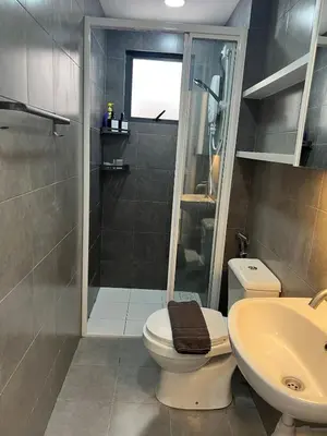 a bathroom with a shower and a toilet and a sink at NaBella Homestay LSH33 Sentul in Kuala Lumpur