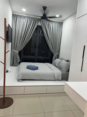 a bedroom with a bed in front of a window at NaBella Homestay LSH33 Sentul in Kuala Lumpur