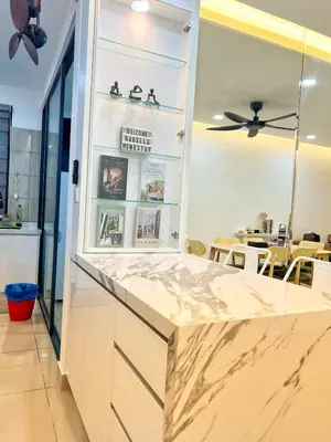 a kitchen with white countertops and a ceiling fan at NaBella Homestay LSH33 Sentul in Kuala Lumpur