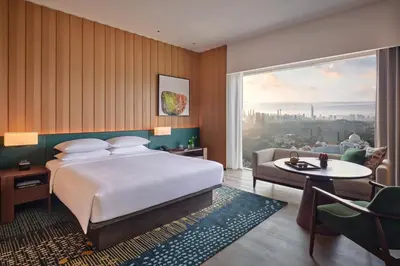 a hotel room with a bed and a large window at Hyatt Regency Kuala Lumpur at KL Midtown in Kuala Lumpur