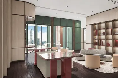 a room with a table and chairs in a building at Kimpton Naluria Kuala Lumpur by IHG in Kuala Lumpur