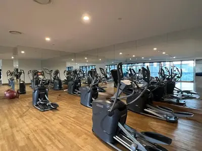 a gym with many treadmills and elliptical machines at KL Sentral Service Apartment-The Establishment KL Sentral EST in Kuala Lumpur