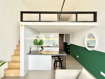 a kitchen and dining room with a loft conversion at KL Sentral Service Apartment-The Establishment KL Sentral EST in Kuala Lumpur