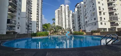 a large swimming pool in the middle of some buildings at Pantai Hillpark phase 5 in Kuala Lumpur